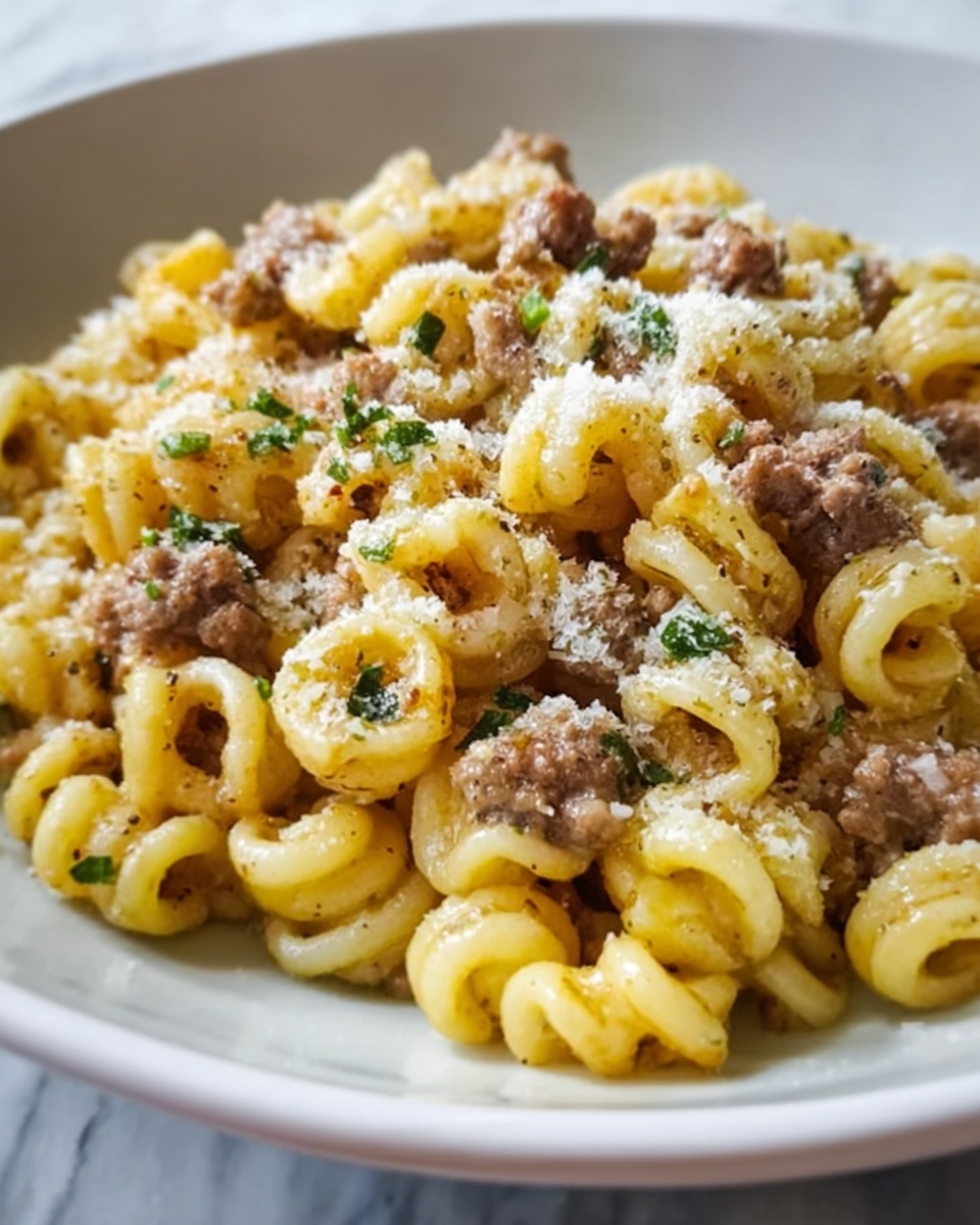 Gramigna Pasta with Sausage and Sage in a Parmigiano Reggiano Sauce Recipe - Recipe Image